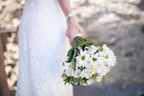 Bride Holding White Floral Bouquet on Wedding Day