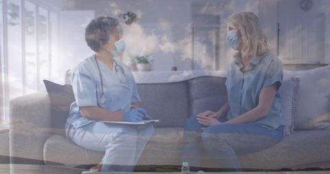 Home healthcare consultation with nurse and patient in living room