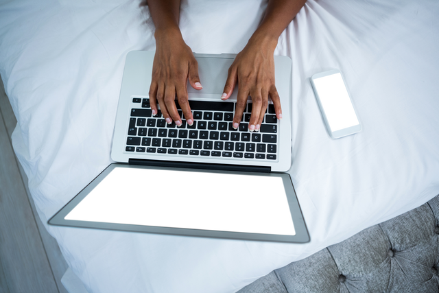 Transparent Laptop Screen on Bed with Typing Hands - Download Free Stock Videos Pikwizard.com