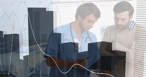 Doctor in Consultation with Patient Reviewing Digital Health Data