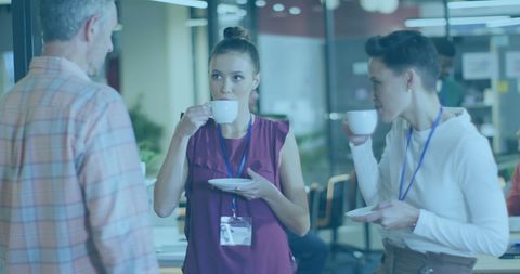 Diverse Professionals Enjoying Coffee Break in Modern Office