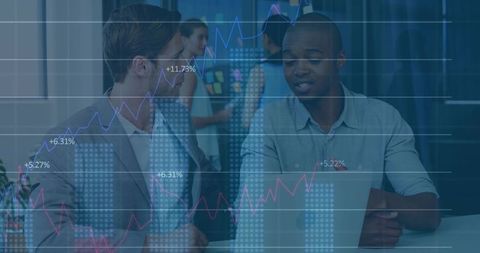 Business Professionals Engaged in Data Analysis Discussion