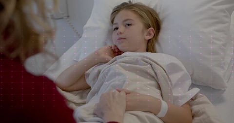 Caring Doctor Visiting Hospitalized Young Girl