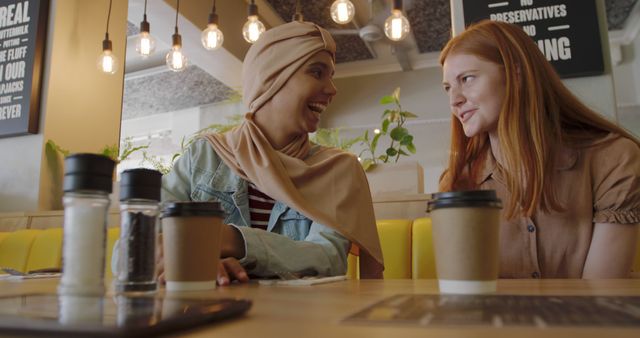 Diverse Friends Enjoying Coffee and Conversation in Modern Café - Download Free Stock Images Pikwizard.com