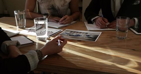 Executives Collaborating During Strategic Business Meeting