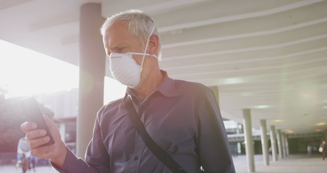 Senior Man Using Smartphone with Face Mask Outdoors - Download Free Stock Images Pikwizard.com