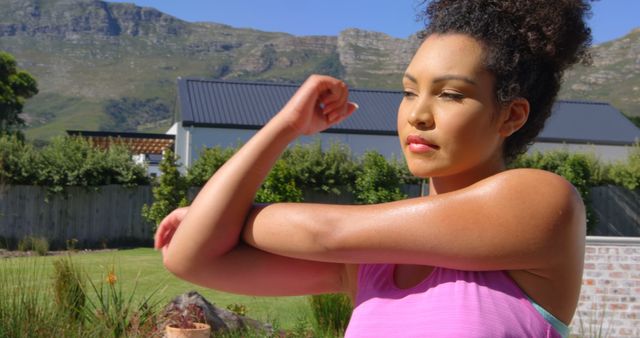 Woman Stretching Arm Outdoors During Workout - Download Free Stock Images Pikwizard.com