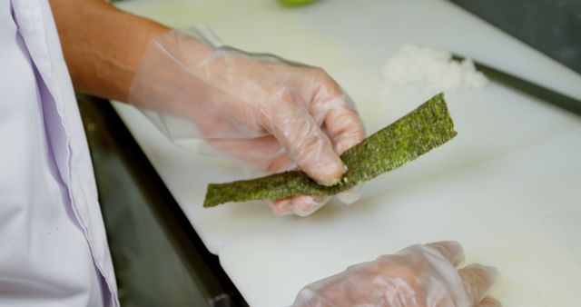 Chef Preparing Sushi with Nori and Rice on Cutting Board - Download Free Stock Images Pikwizard.com