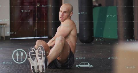 Shirtless Athlete Stretching in Gym with Intensity and Determination
