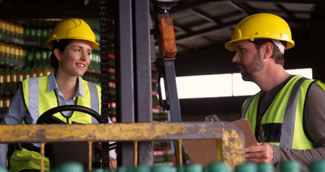 Warehouse Workers Discussing Logistics In Industrial Setting - Download Free Stock Images Pikwizard.com