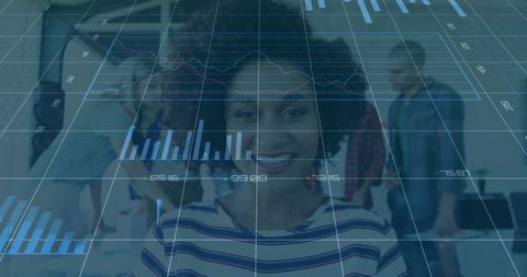 African American woman smiling showing data overlay in open-plan office collaboration