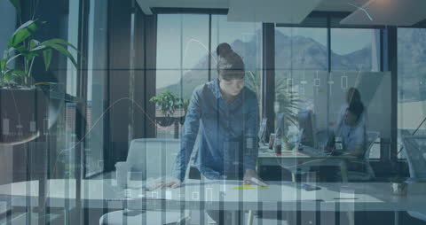 Businesswoman Analyzing Data in Modern Office with Digital Graph Overlay