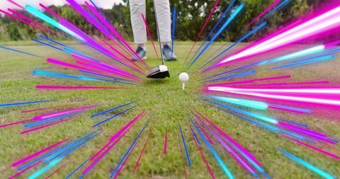 Senior female golfer lining up driver on tee box with neon streaks highlighting precision