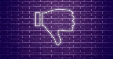 Neon Thumbs Down Icon Illuminated Against Purple Brick Wall
