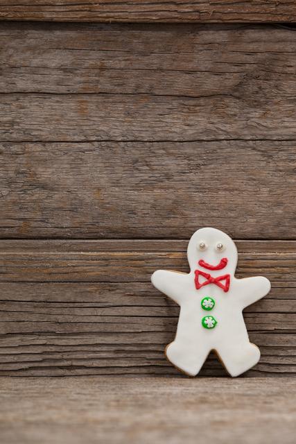 Gingerbread Man Cookie Against Rustic Wooden Background - Download Free Stock Photos Pikwizard.com