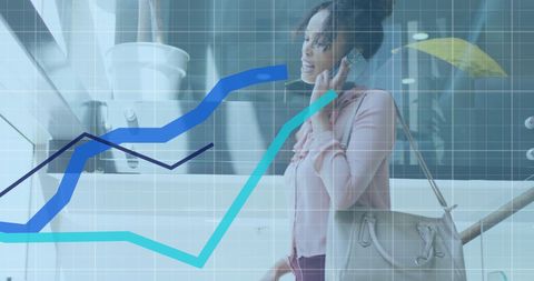 Businesswoman analyzing data trends while using smartphone