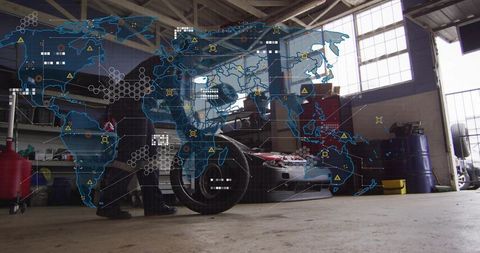 Mechanic inspecting car engine in garage with digital world map hud and tire focus