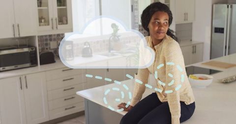 Woman in Modern Kitchen with Futuristic Cloud Graphic