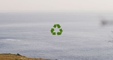 Recycling Symbol Overlooking Calm Ocean Scenery