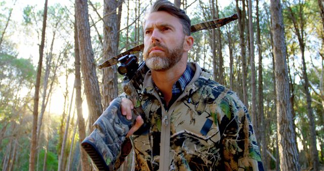 Hunter in Forest Holding Crossbow with Determined Look - Download Free Stock Images Pikwizard.com