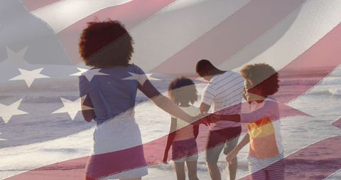 Family Leisure Walk on Beach with American Flag Overlay at Sunset