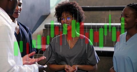 Healthcare team discussing clinical data with candlestick charts for medical analytics