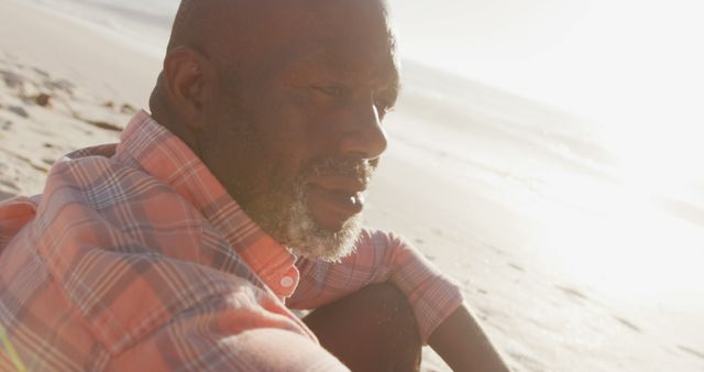 African American Man Contemplating Life on Beach at Sunset - Download Free Stock Images Pikwizard.com