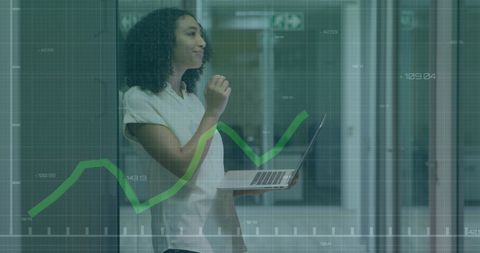 Confident businesswoman analyzing financial growth charts