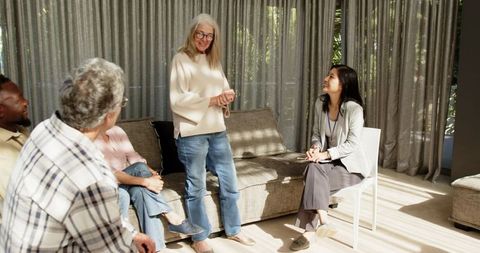 Diverse group engaging in therapeutic group therapy session