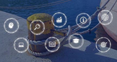 Yellow mooring bollard wrapped in braided rope on pier with digital icons overlay
