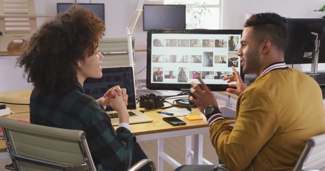 Creative Professionals Collaborating in Modern Office with Dual Screens - Download Free Stock Images Pikwizard.com