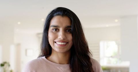 Smiling Mid Adult Woman in Minimalist Home Ambiance