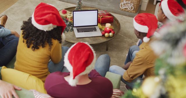 Group of Friends Watching Laptop Together During Christmas - Download Free Stock Images Pikwizard.com