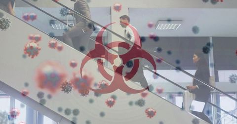 Business professionals walking amidst virus illustration and biohazard symbol