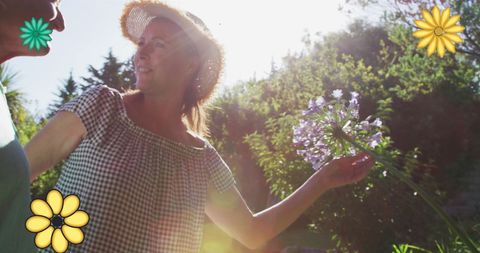 Caucasian Couple Enjoying Sunny Garden with Flowers