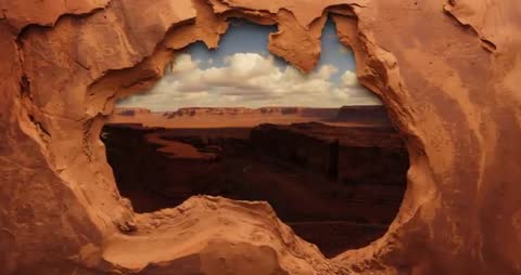 Time-lapse of Drifting Clouds in Sandstone Canyon Window