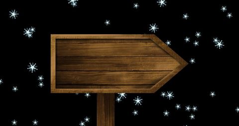 Wooden Rustic Directional Sign in Snowy Night