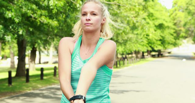 Young Woman Stretching Before Outdoor Workout - Download Free Stock Images Pikwizard.com