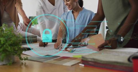 Creative Team Collaborating on Blueprints with Digital Overlay