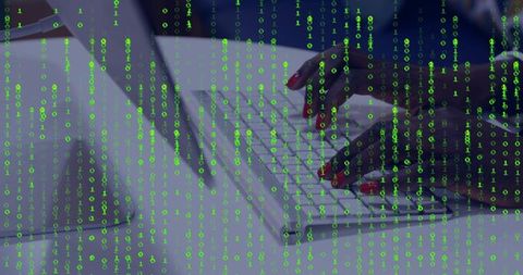 Hands typing code on white keyboard with digital binary overlay