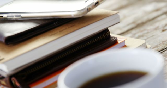 Stack of Notebooks with Smartphone and Coffee Cup on Wooden Table - Download Free Stock Images Pikwizard.com