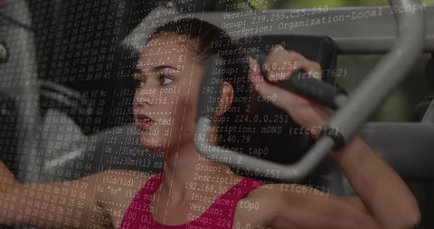 Woman pressing chest-press machine wearing bright pink tank top with code overlay
