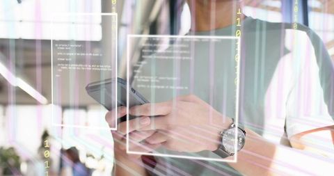 Holding smartphone and tapping screen with augmented UI overlays in coworking cafe