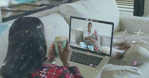 Virtual meeting on laptop with digital graphics overlay