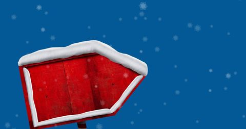 Christmas Sign with Snow Against Blue Sky