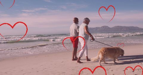 Senior Couple Walking Dog on Beach with Heart Graphics