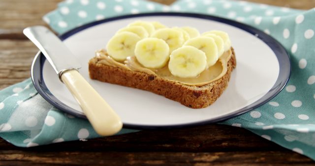 Whole Wheat Bread with Peanut Butter and Banana Slices on Plate - Download Free Stock Images Pikwizard.com