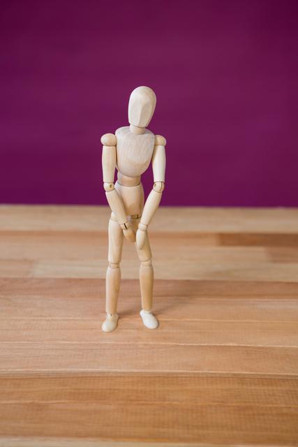 Figurine performing stretching exercise - Download Free Stock Photos Pikwizard.com