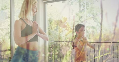 Mother and Daughter Enjoy Morning Yoga at Home
