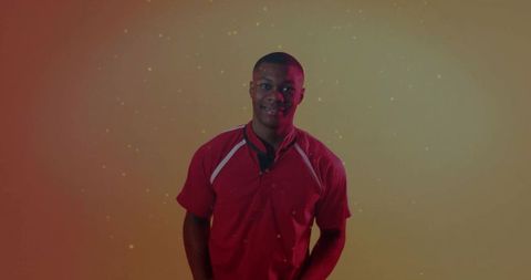 Energetic Man in Red Sports Shirt in Studio with Vibrant Background